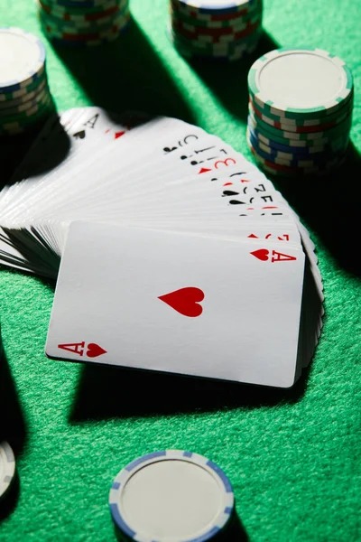 Casino Hold'em game interface showing two hole cards and decision buttons on betlazada